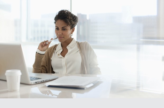 Businesswoman using laptop in office