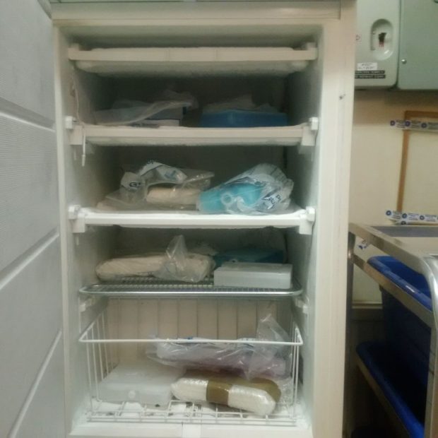 Cold packs stored in a small freezer.  Cold packs are wrapped in paper which poses a hygiene hazard.  There is a large variety of different types of ice packs with no control on this or how long the individual packs have been conditioned for. 