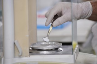 accurately measuring ingredients into a petri dish
