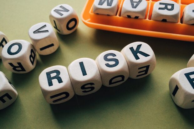 Scrabble pieces spelling the word 'risk'