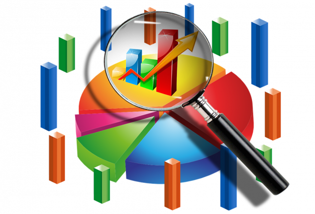 magnifying glass focusing on a pie chart illustrating scrutiny of data