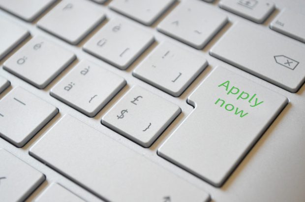 Keyboard with the words 'Apply now' on the return key