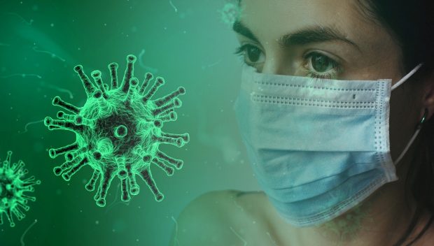 Lady with a face mask and virus particles representing Covid infront of her